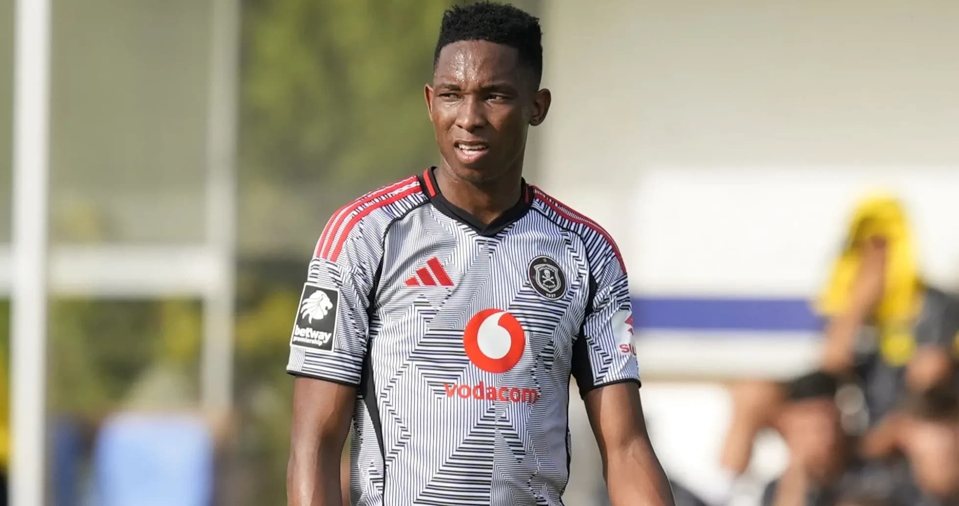 Player in Orlando Pirates jersey on the field
