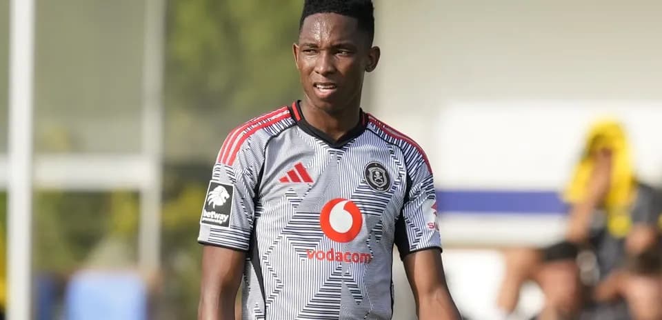 Player in Orlando Pirates jersey on the field