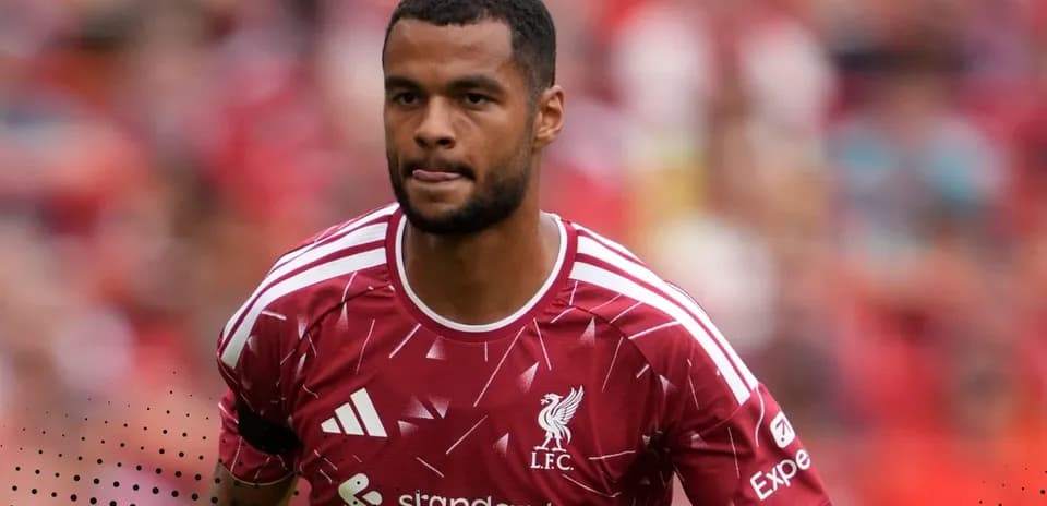 Player wearing Liverpool jersey during match warm-up