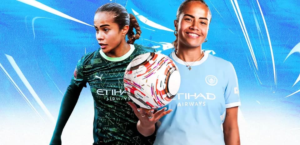 Two soccer players in Manchester City kits holding a ball