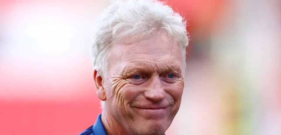 Manager smiling before the match at the stadium