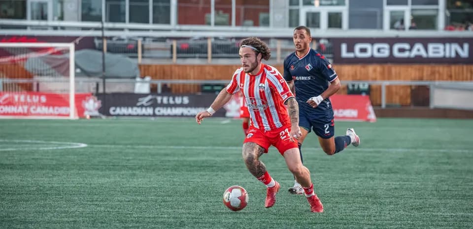 Player dribbling the ball during Ottawa match