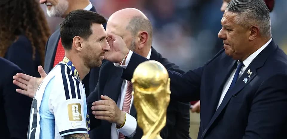 Lionel Messi receiving trophy after championship victory