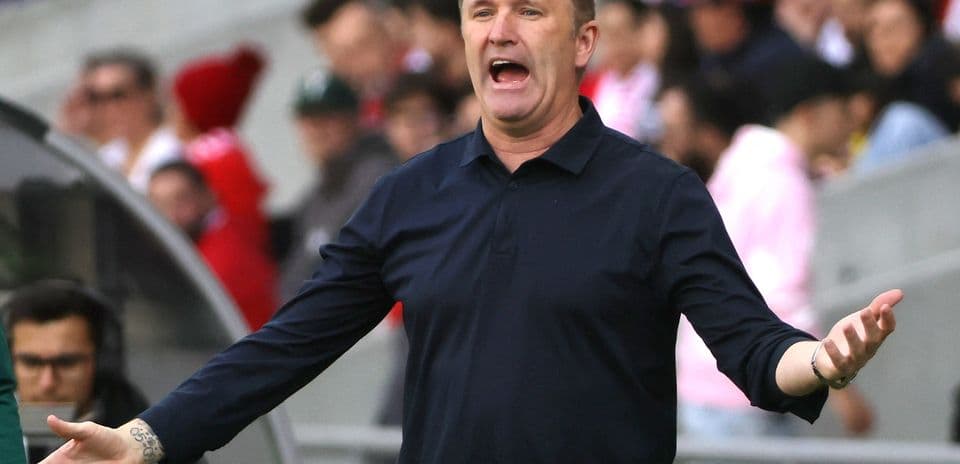 Coach gesturing during a match from the sideline