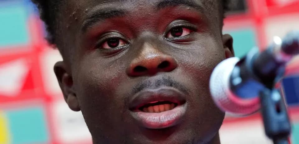 Player speaking into microphone at press conference