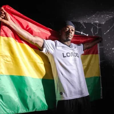 Player holding Bolivian flag in celebration