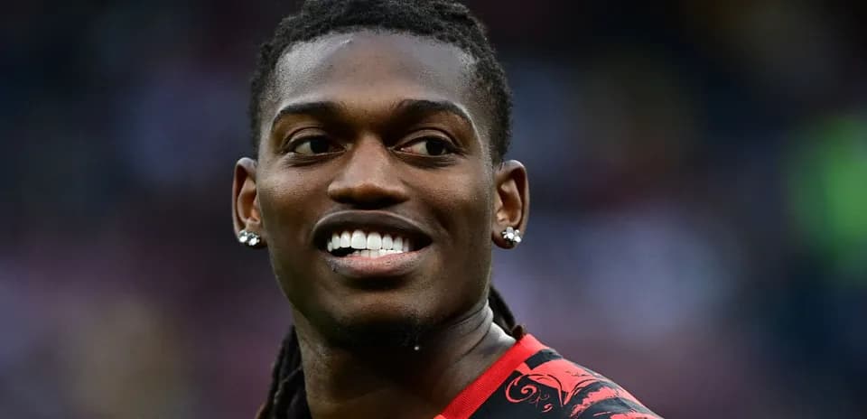 Player smiling while wearing a red jersey