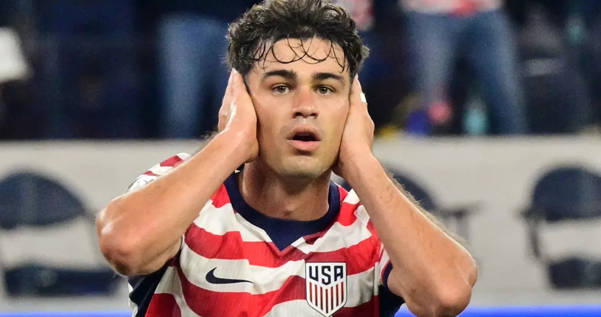 Player with USA jersey reacting during match