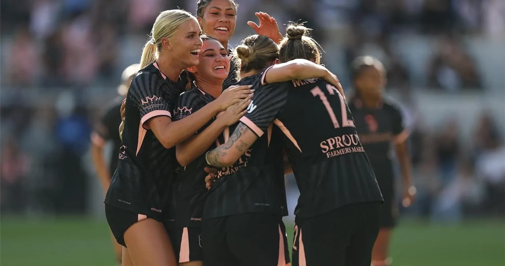 Angel City players celebrating a goal
