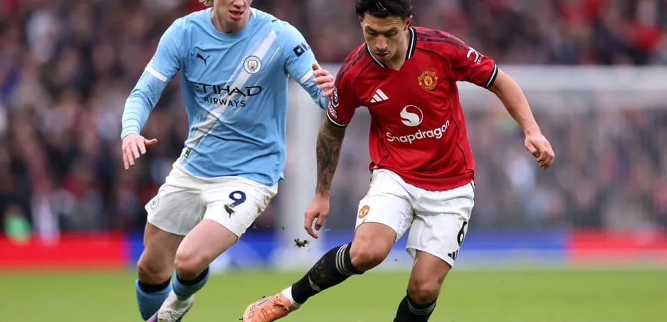 Player dribbling the ball during Manchester derby