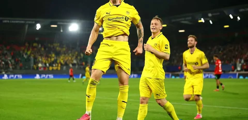 Players celebrating during UEFA Champions League match