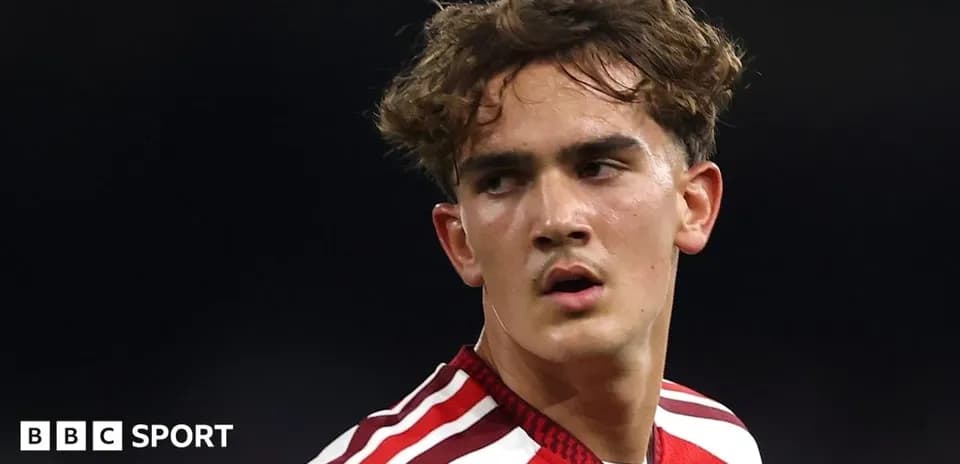 Player in red kit looking during a match