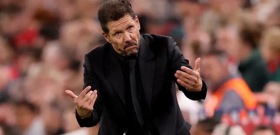 Manager gesturing during a football match