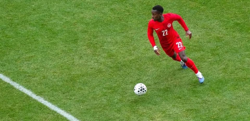 Canadian player running with the ball