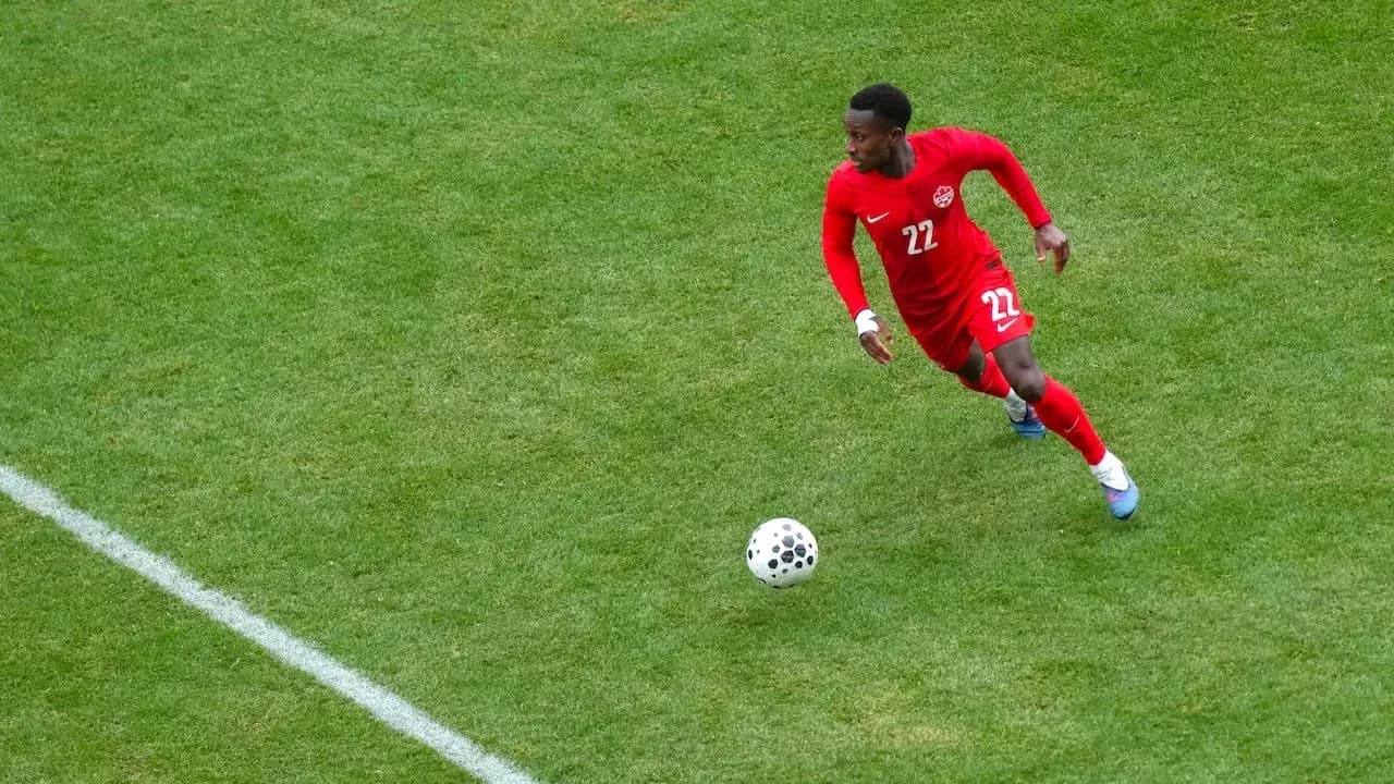 Canadian player running with the ball