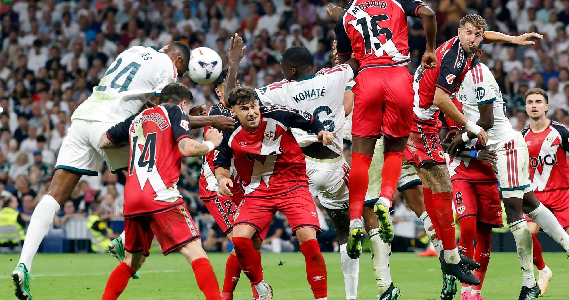 Players contesting a corner kick in La Liga