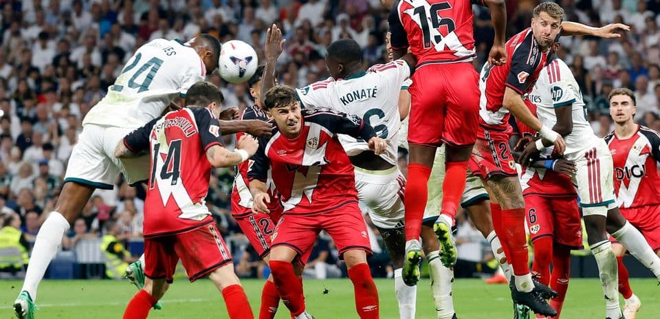 Players contesting a corner kick in La Liga