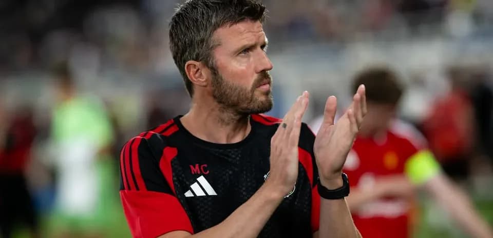Coach applauding during post-match warm-up