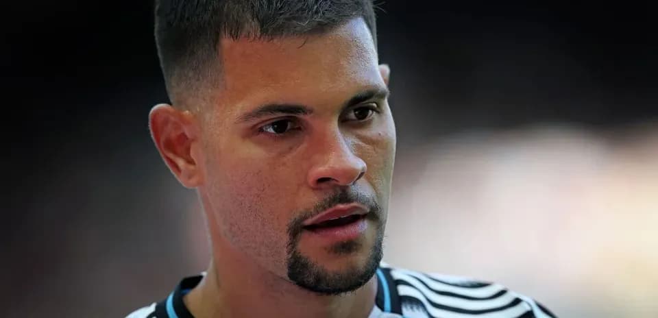 Player wearing a striped jersey, focused expression