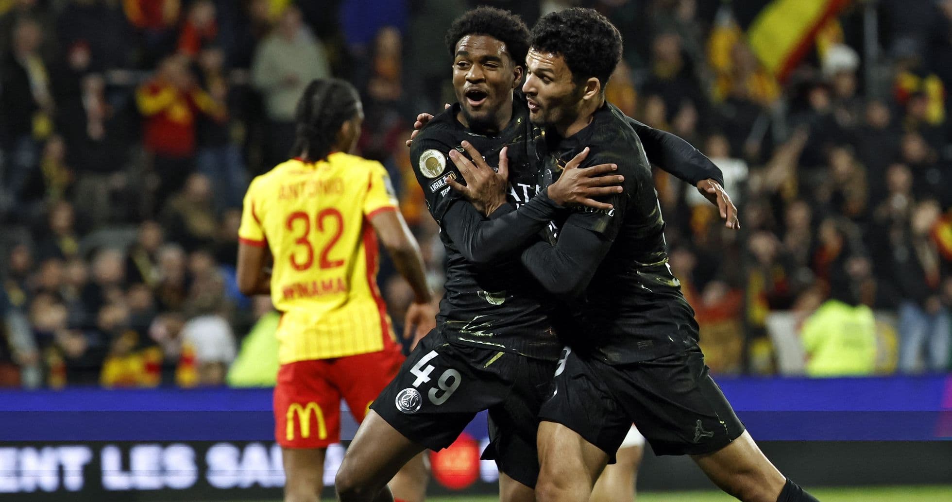 Players celebrating a goal during match action