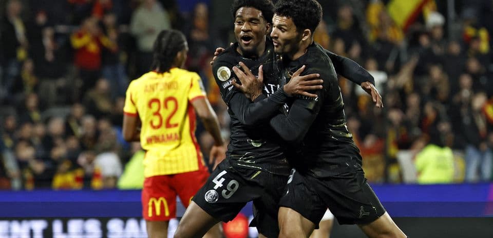 Players celebrating a goal during match action