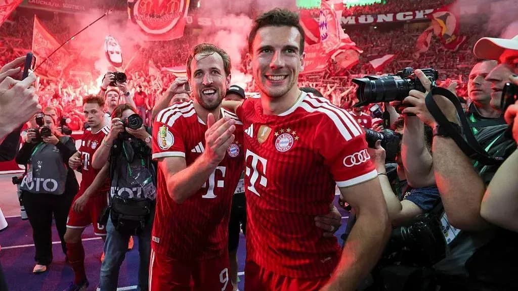 Bayern Munich players celebrating with fans in stadium