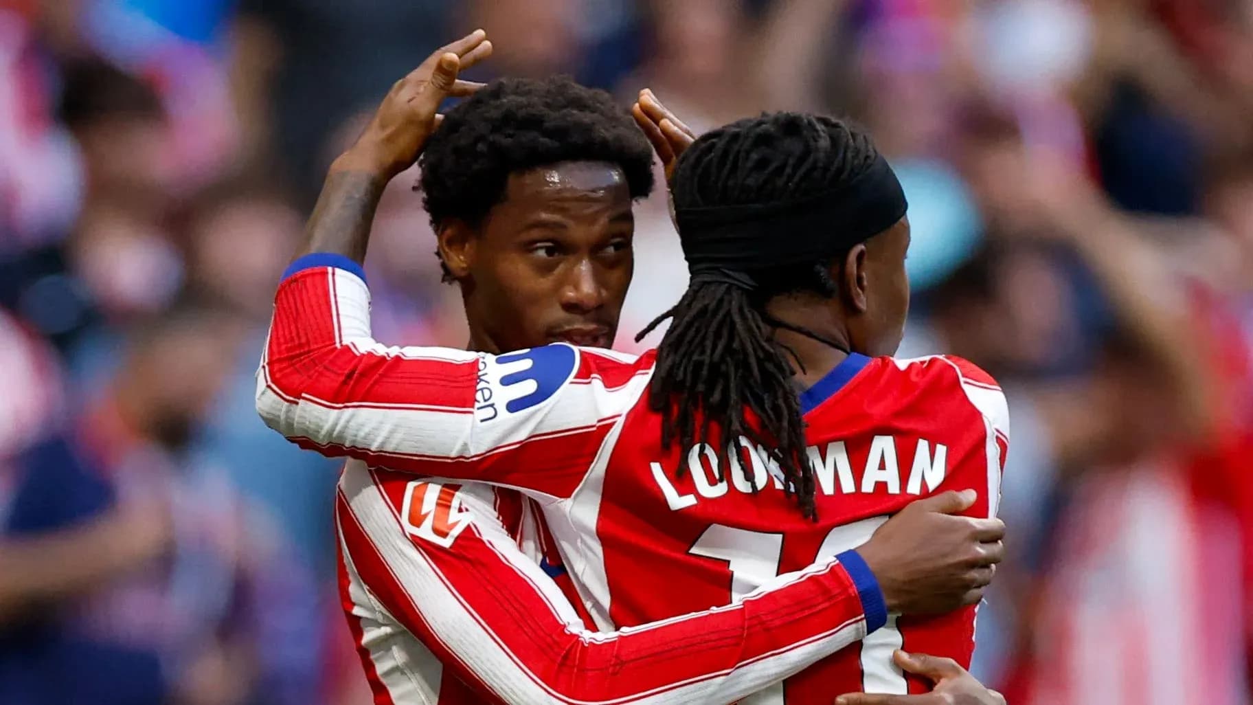 Two Atlético Madrid players celebrating a goal