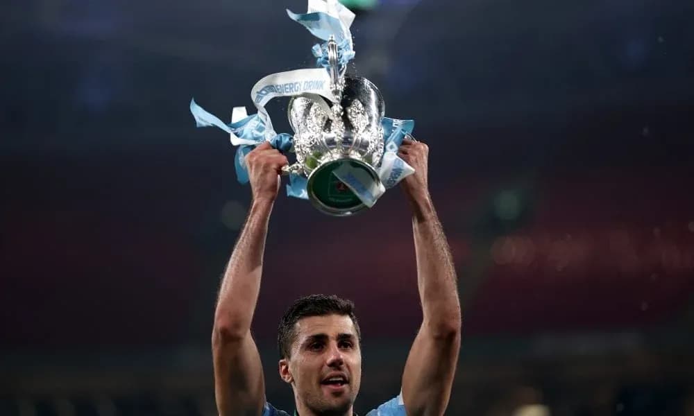 Player holding trophy aloft after victory