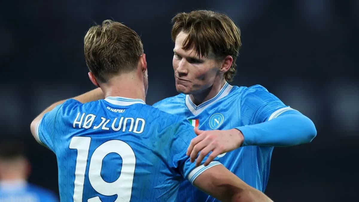 Two Napoli players celebrating on the field