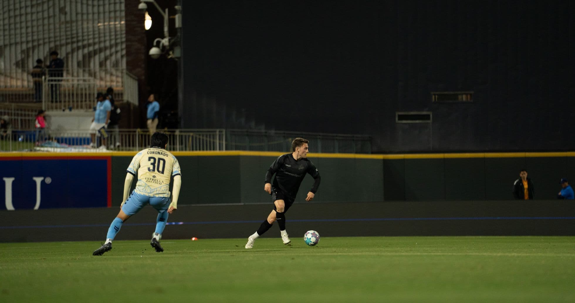Player dribbling ball during Colorado Springs match