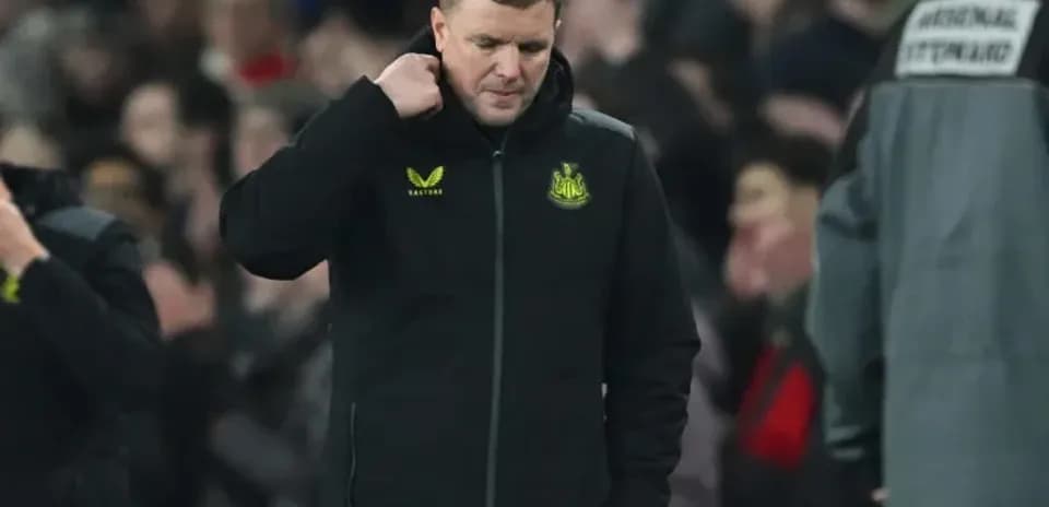 Newcastle United manager walking off field after match