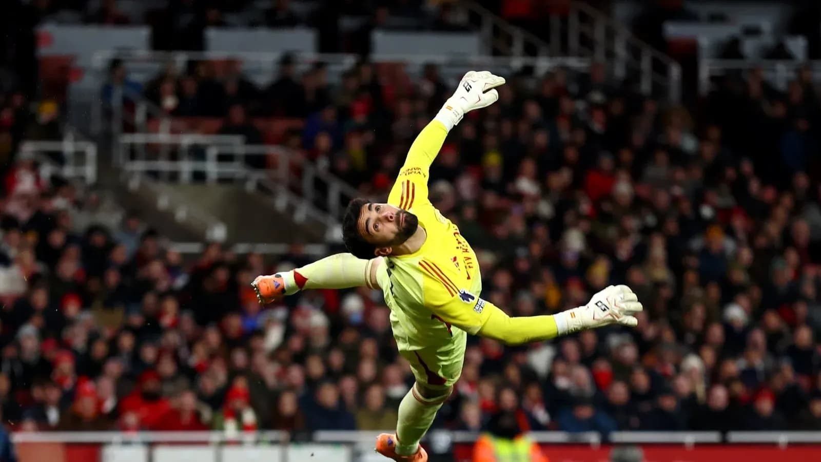 Goalkeeper diving to make a save during match