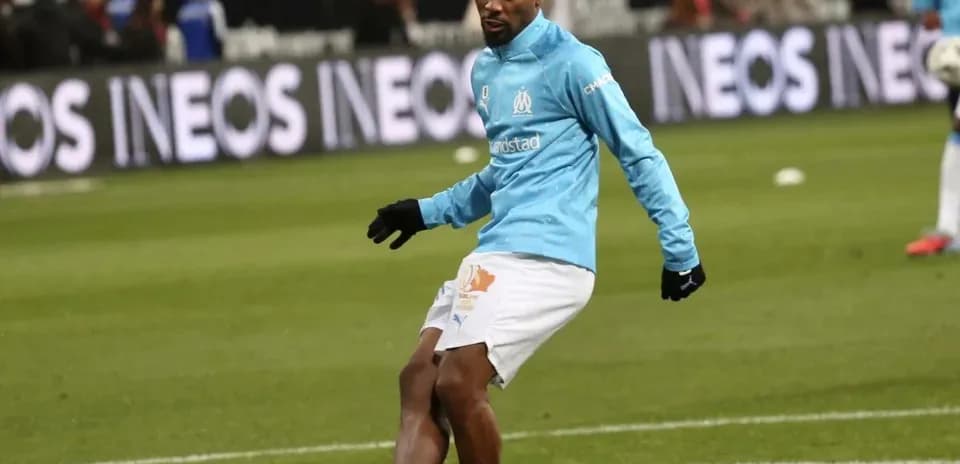 Player warming up on pitch before the match
