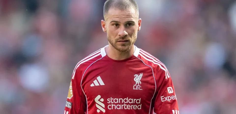 Football player in Liverpool jersey on the pitch