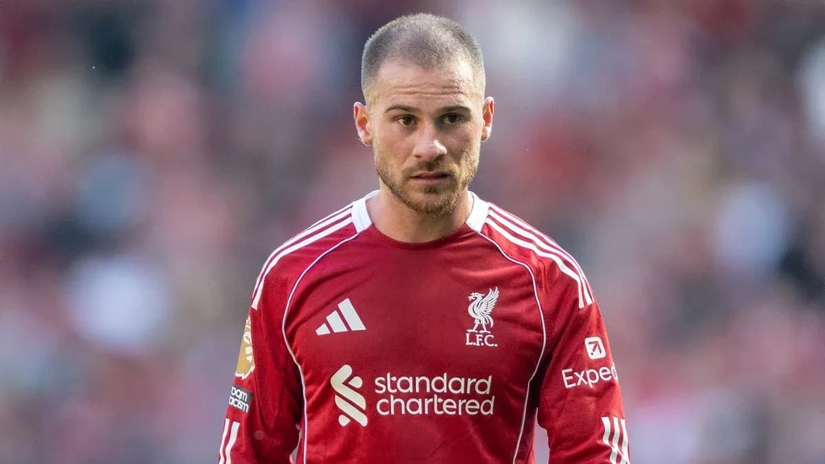 Football player in Liverpool jersey on the pitch