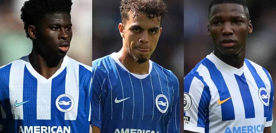 Three Brighton players in blue home jerseys