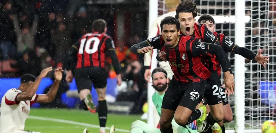 Bournemouth players celebrate goal against Liverpool