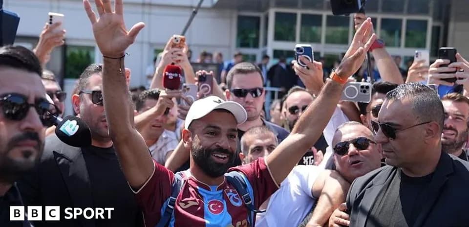Player greeting fans during arrival at venue