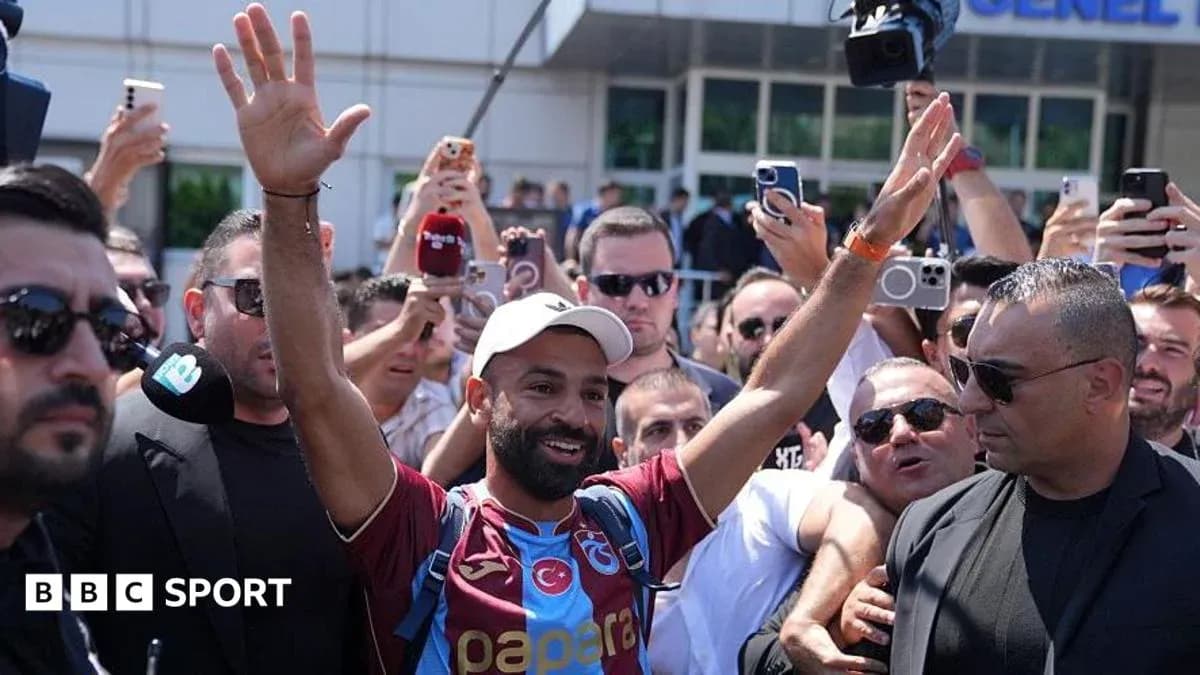 Player greeting fans during arrival at venue