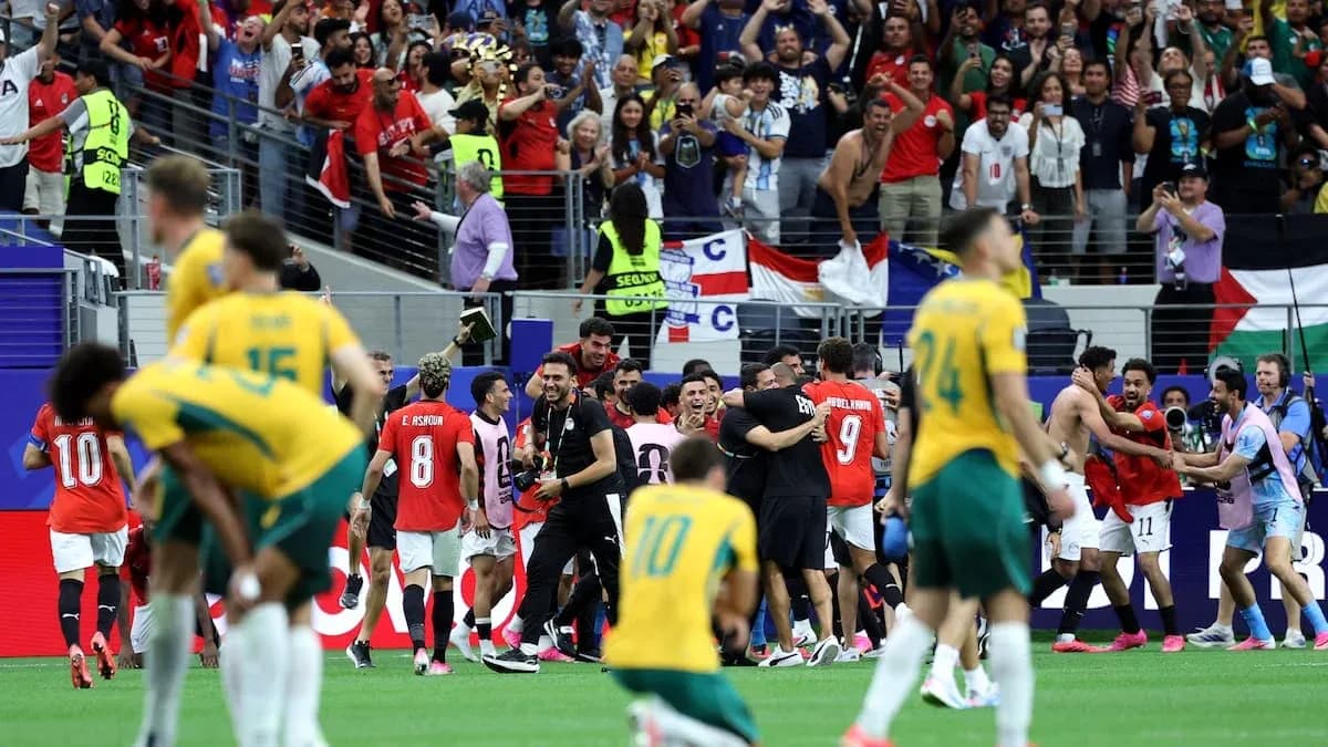 Players celebrating victory with fans in stadium