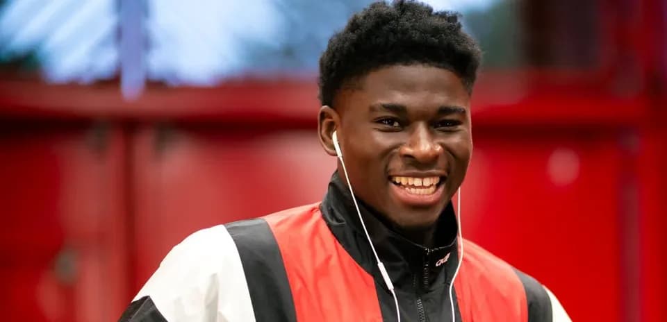 Smiling athlete wearing headphones in casual attire