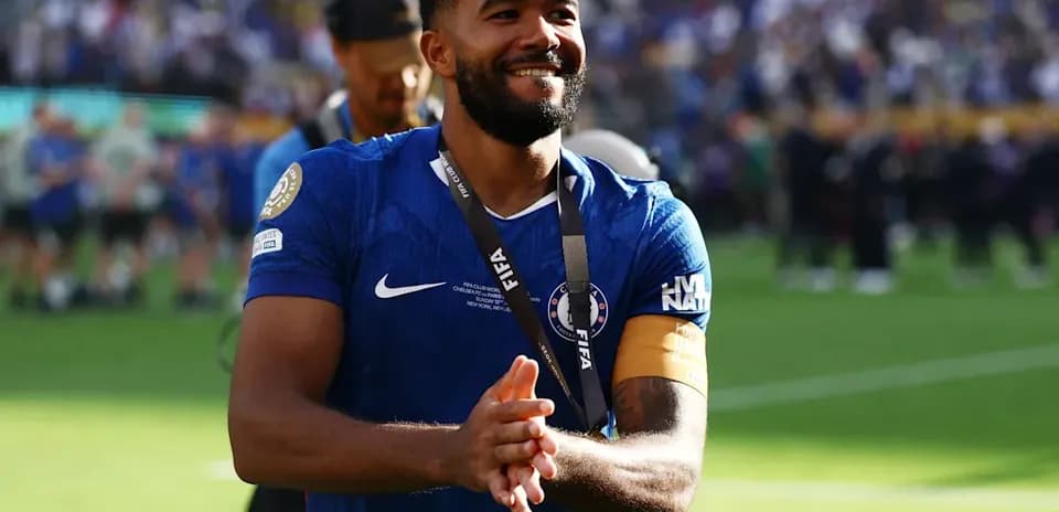Player in blue jersey celebrating on the field