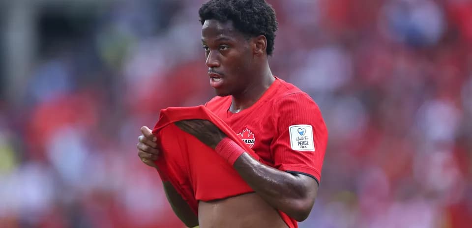 Canadian player adjusting jersey during match