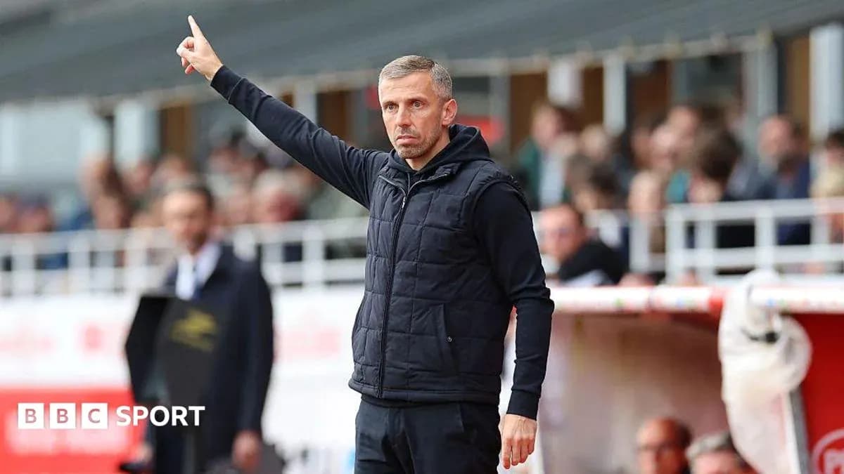 Coach signaling from the sidelines during match