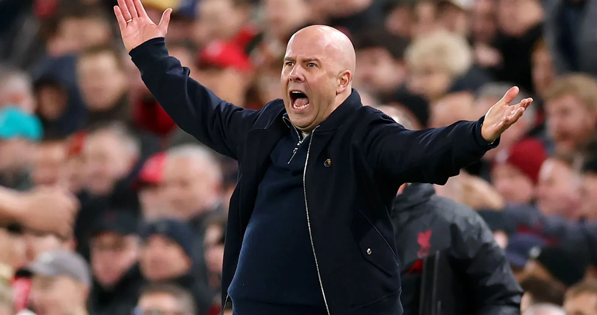Coach gesturing passionately during a match