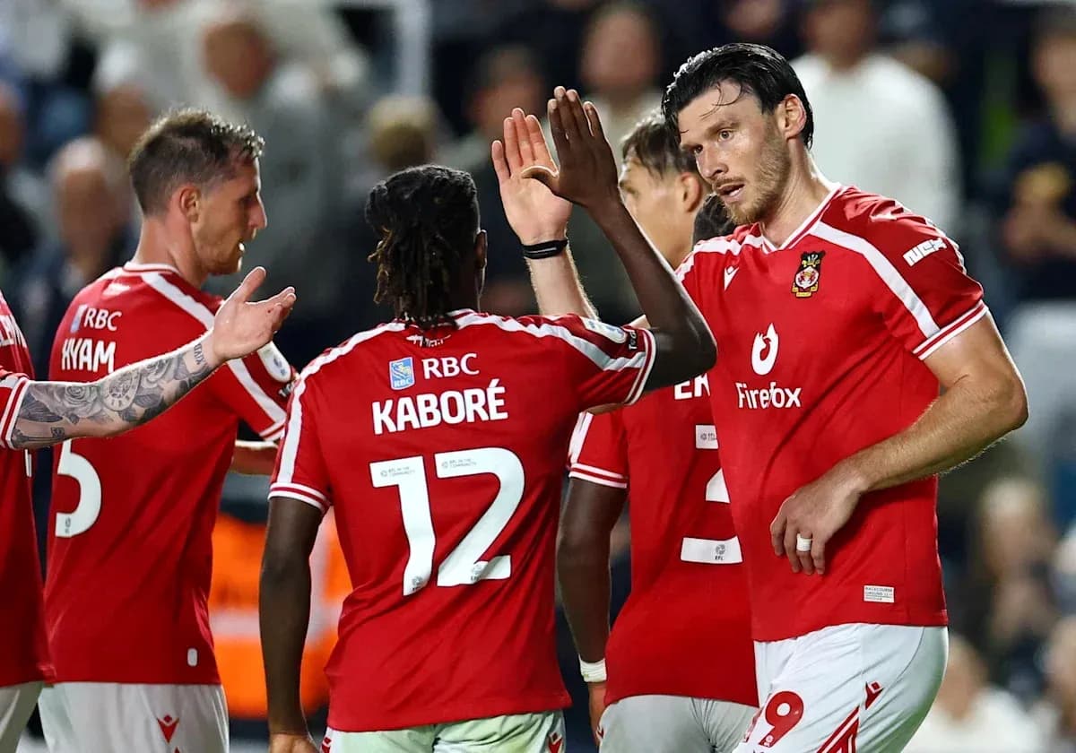 Players celebrating a goal on the pitch