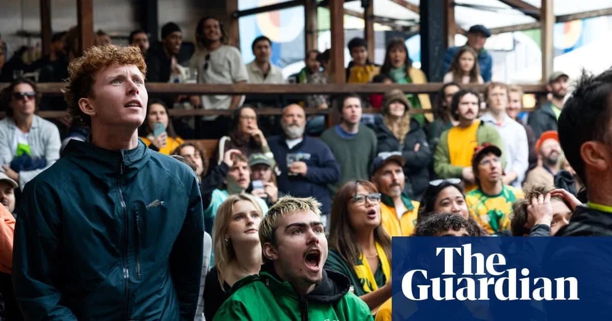 Crowd watching sports event with varied expressions