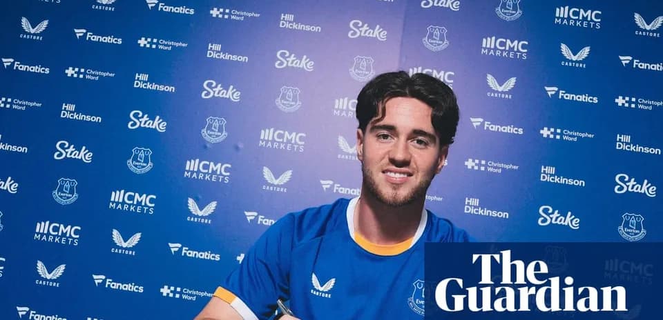 Player signing contract at Everton press event
