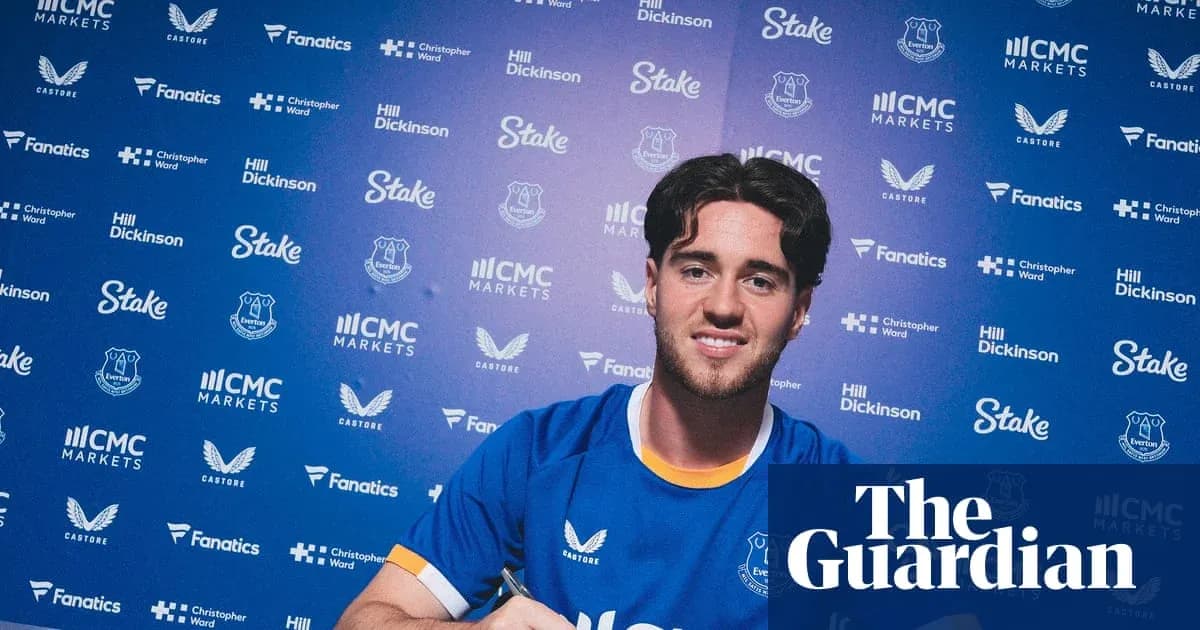 Player signing contract at Everton press event