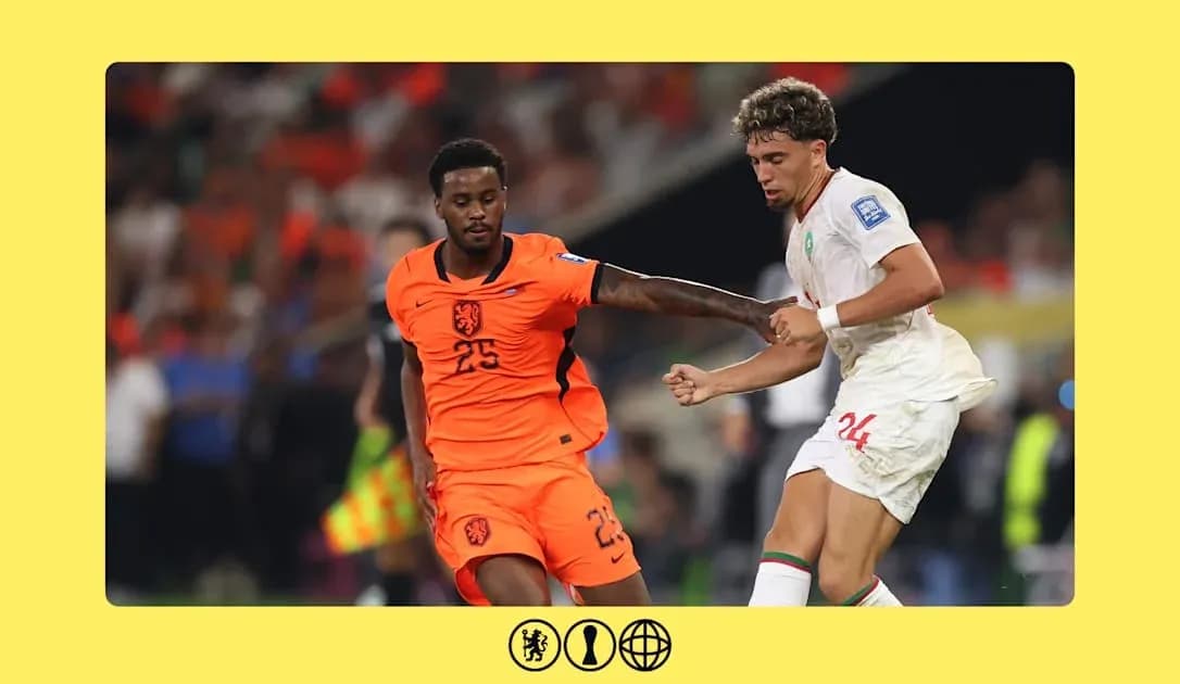 Player in orange and player in white competing for ball